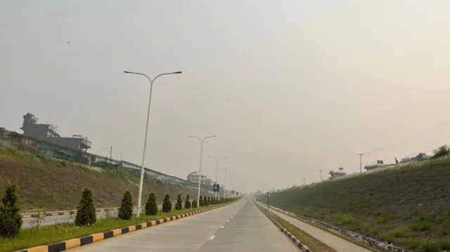 The same mountain range covered in haze, taken from roughly the same location